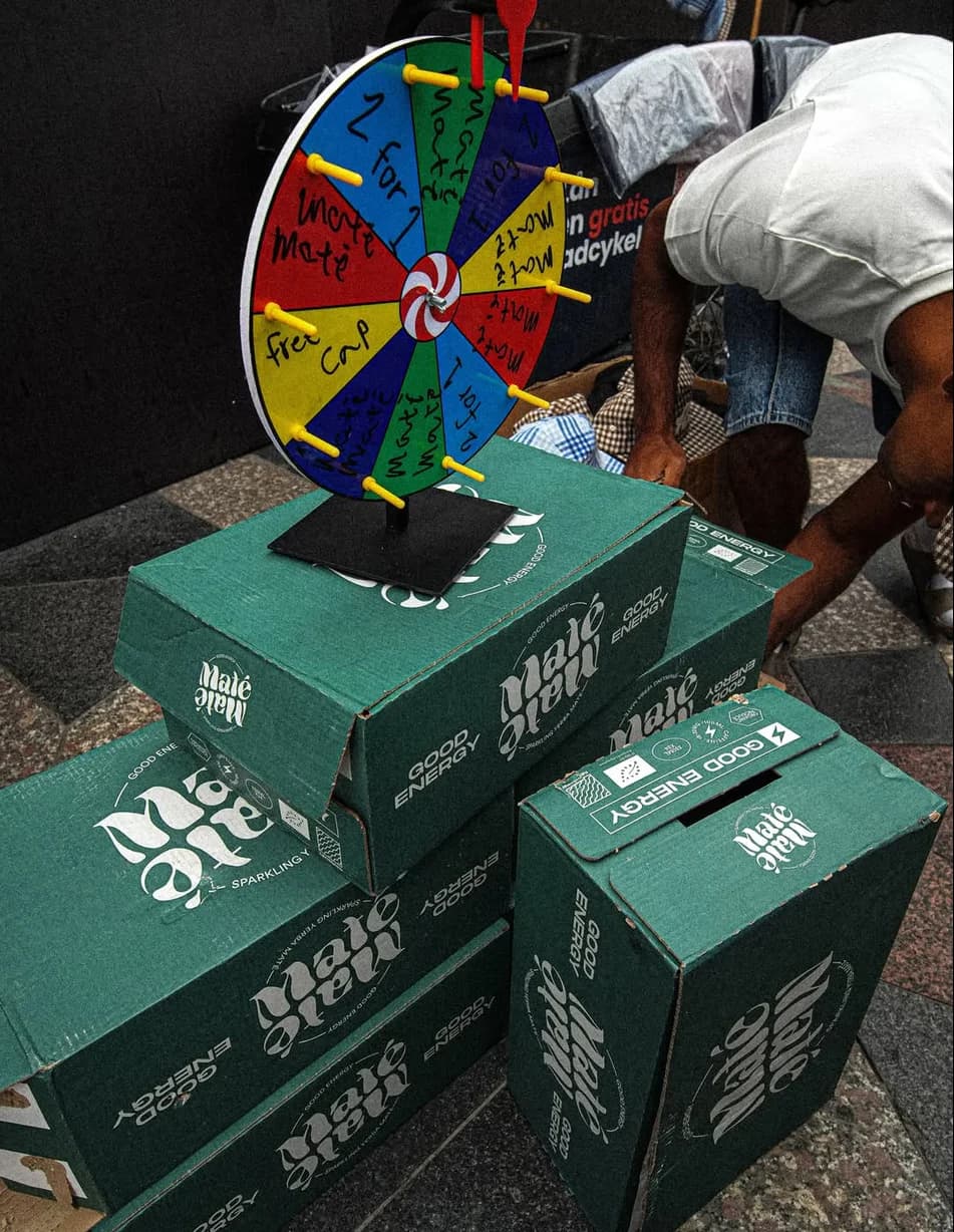 Prize wheel with a free cap slot on top of Maté boxes